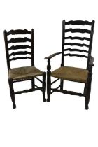 A set of 8 (6 + 2) matched ladder back French oak Dining Chairs, covered with rush seats (one