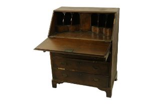 A Queen Anne style slope front Ladies Bureau, with crossbanded top opening to reveal fitted