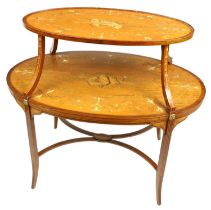 An oval Edwardian two tier marquetry inlaid satinwood Supper Table, the top inlaid with musical