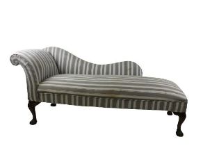 A Georgian style Chaise Longue, the half shaped back with shaped head rest covered in grey and cream