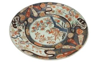A large 18th Century Japanese Imari Dish, 55cms (21 1/2") diameter, decorated with exotic birds,