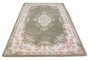 An attractive Tolech design Inolius woollen Carpet, the green ground with central floral motif and