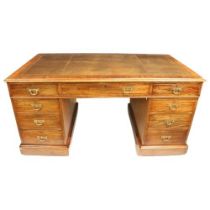 A rectangular Victorian style pedestal Desk, in the manner of Jas. Shoolbred & Co., the moulded