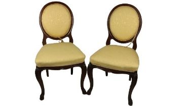 A pair of French style shield back mahogany Side Chairs, with upholstered backs and seats covered in