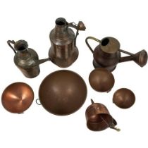 A collection of old Copperware, comprising a Garden Watering Can, a straining Funnel, an Iranian