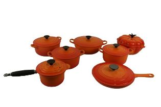 A pumpkin shaped Le Creuset Pot and Cover, three graduating circular pots and covers with rimmed
