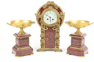 A fine French Art Nouveau three piece Mantle Clock Garniture, in red Griotte marble, the clock