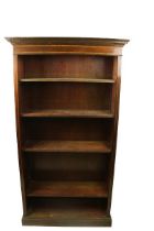 A Georgian style tall mahogany inlaid and crossbaned Open Bookcase, with dental moulded cornice with