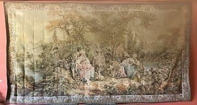 A fine large polychrome machine made Louis XV style Tapestry, depicting figures in a woodland