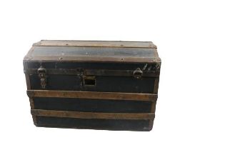 A 19th Century dome top wooden and metal bound Travel Trunk. (1)