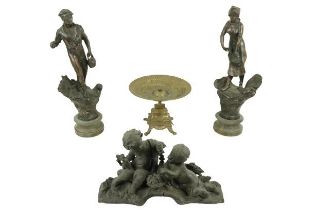 A pair of Spelter Figures, 'L'Agriculture' 18'' (46cms), together with a brass Table Centre, on four