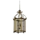 A Georgian style brass Hall Lantern, domed top with scrolled supports over an octagonal frame with