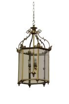 A Georgian style brass Hall Lantern, domed top with scrolled supports over an octagonal frame with