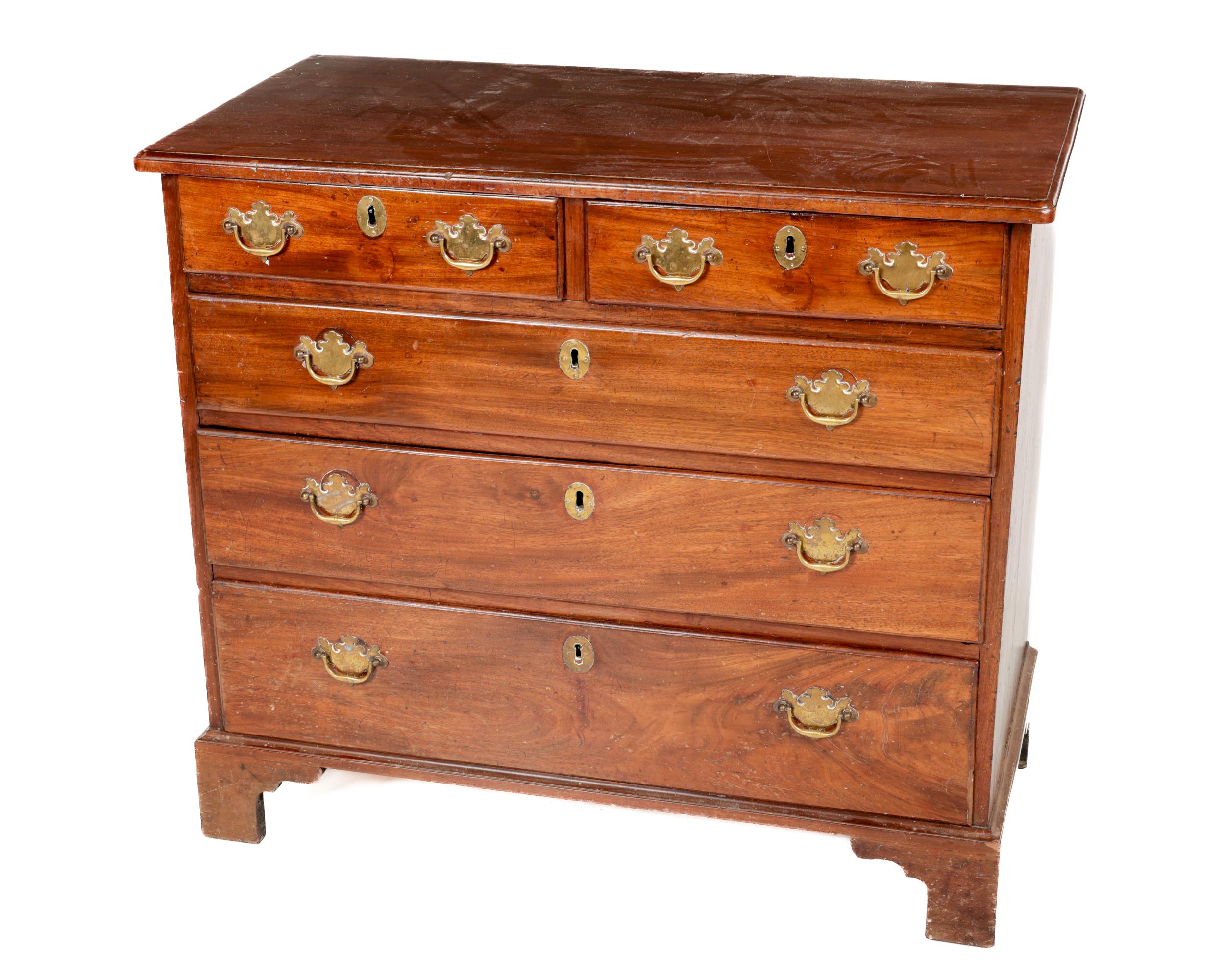 A Georgian mahogany Chest, with plain moulded top over two short and three long graduating drawers