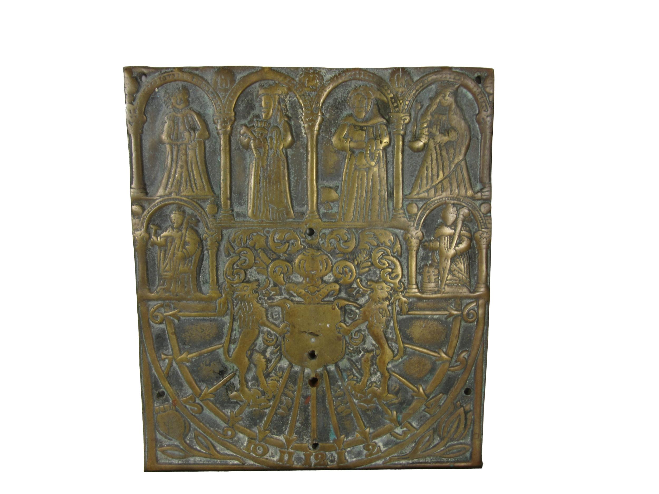 An antique heavy brass Sundial, of square format decorated with medieval type figures, and a central
