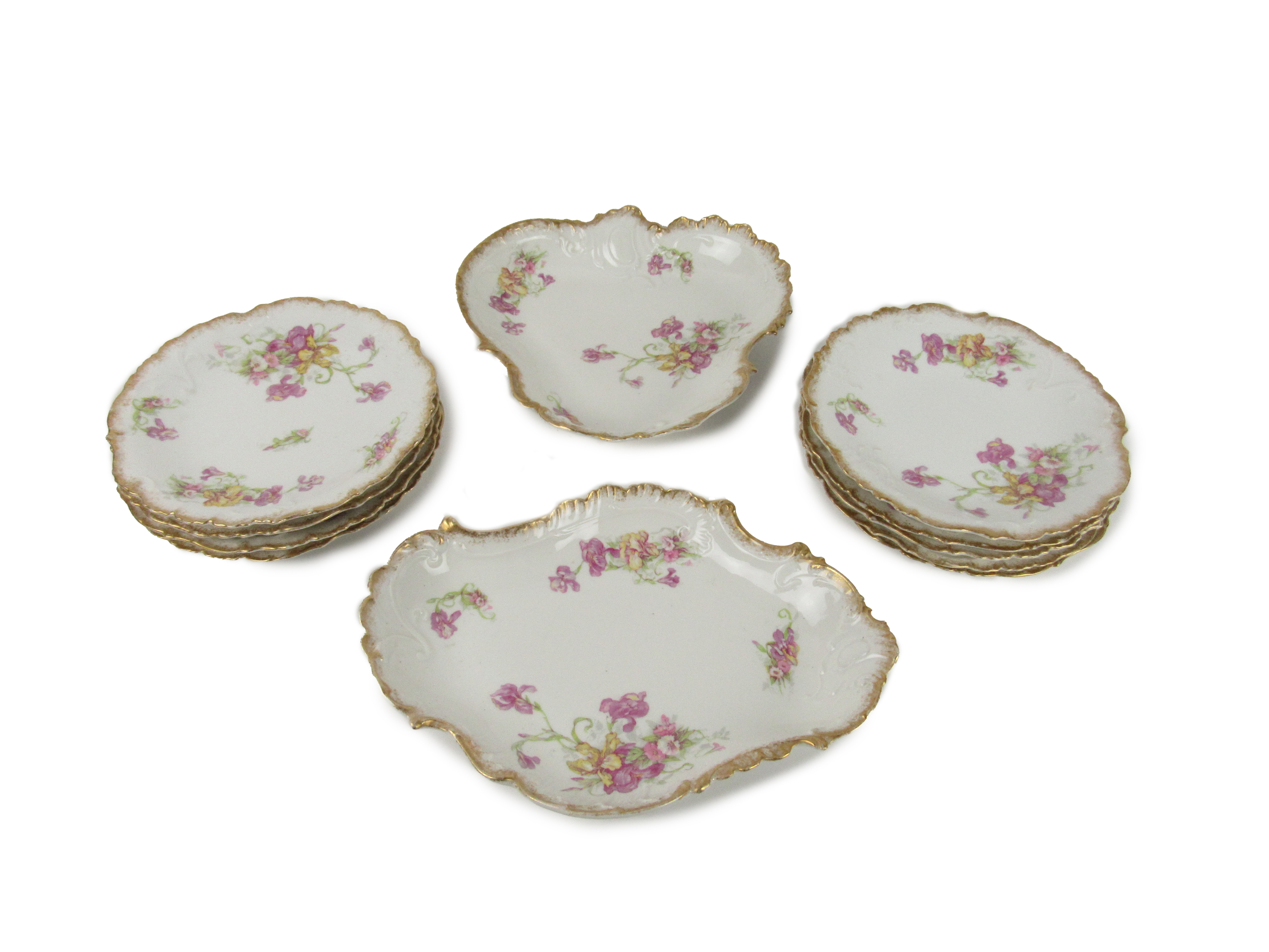 An attractive 11 piece Limoges French porcelain Dessert Service, each decorated with pink flowers,