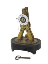 A 19th Century French brass miniature Skeleton Clock, with circular enamel dial with Roman numerals,