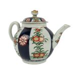 A small Worcester Teapot, and lid, with dark blue and floral decorated panels, and with blue seal