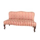 A Victorian mahogany framed humpback Couch or Window Seat, covered in Regency stripe fabric on front