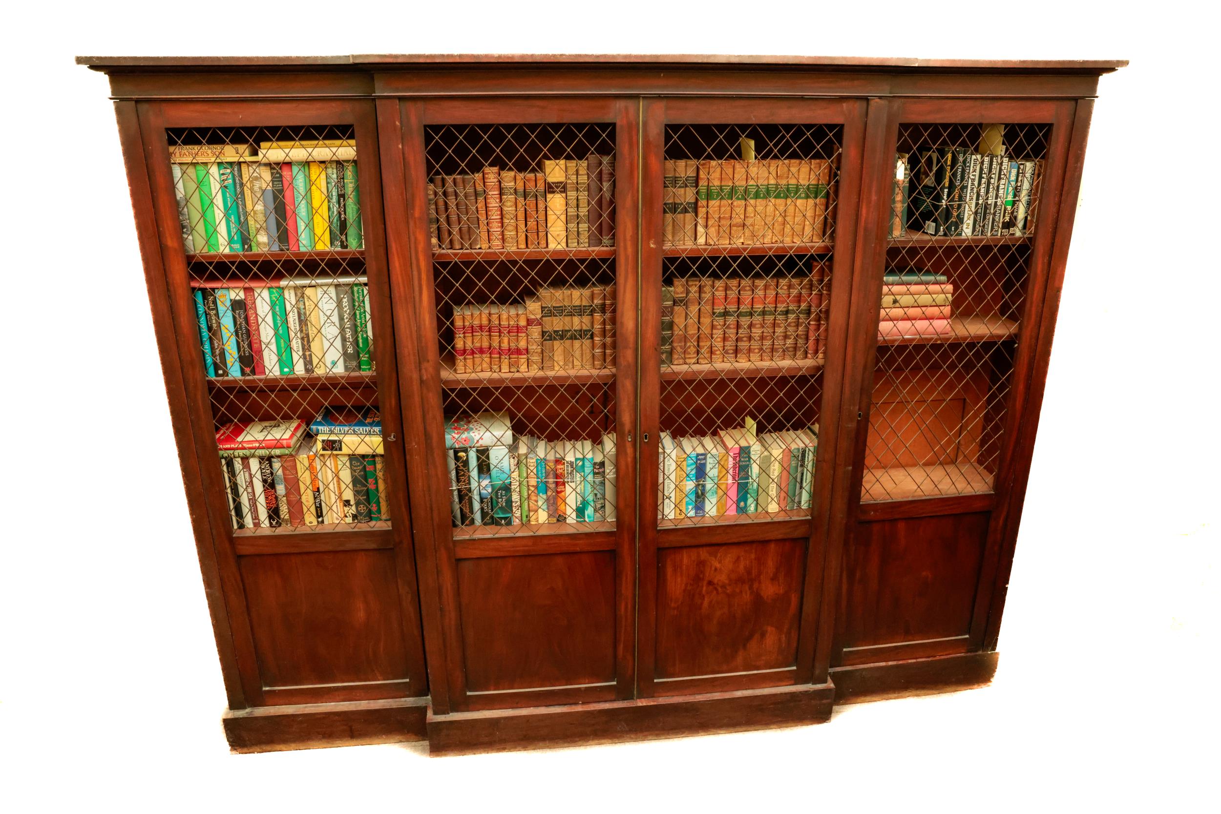 A fine quality Regency period mahogany breakfront Bookcase, the moulded cornice over four long