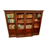 A fine quality Regency period mahogany breakfront Bookcase, the moulded cornice over four long