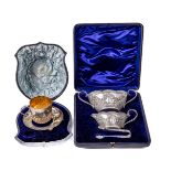 A cased English silver Christening Cup and Saucer, and Spoon, by E.H. (Wm. Hutton & Sons) retailed
