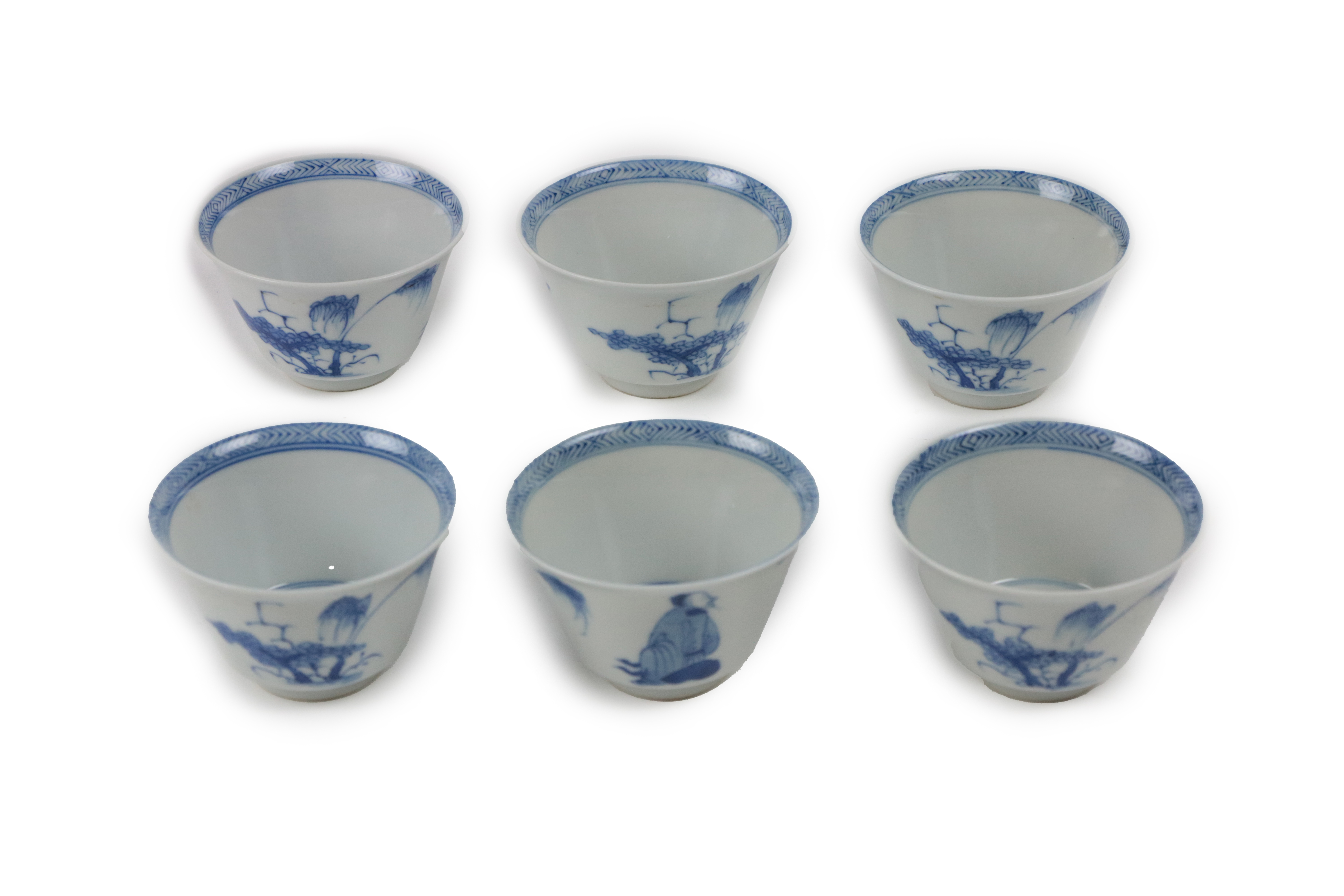 A set of 6 Chinese blue and white Tea Cups, each with landscape medallion interior, the exterior