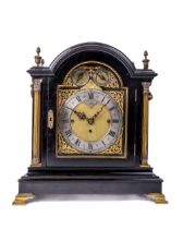 A fine quality Victorian ebonised chiming Bracket Clock, the arched top with ornate brass acorn