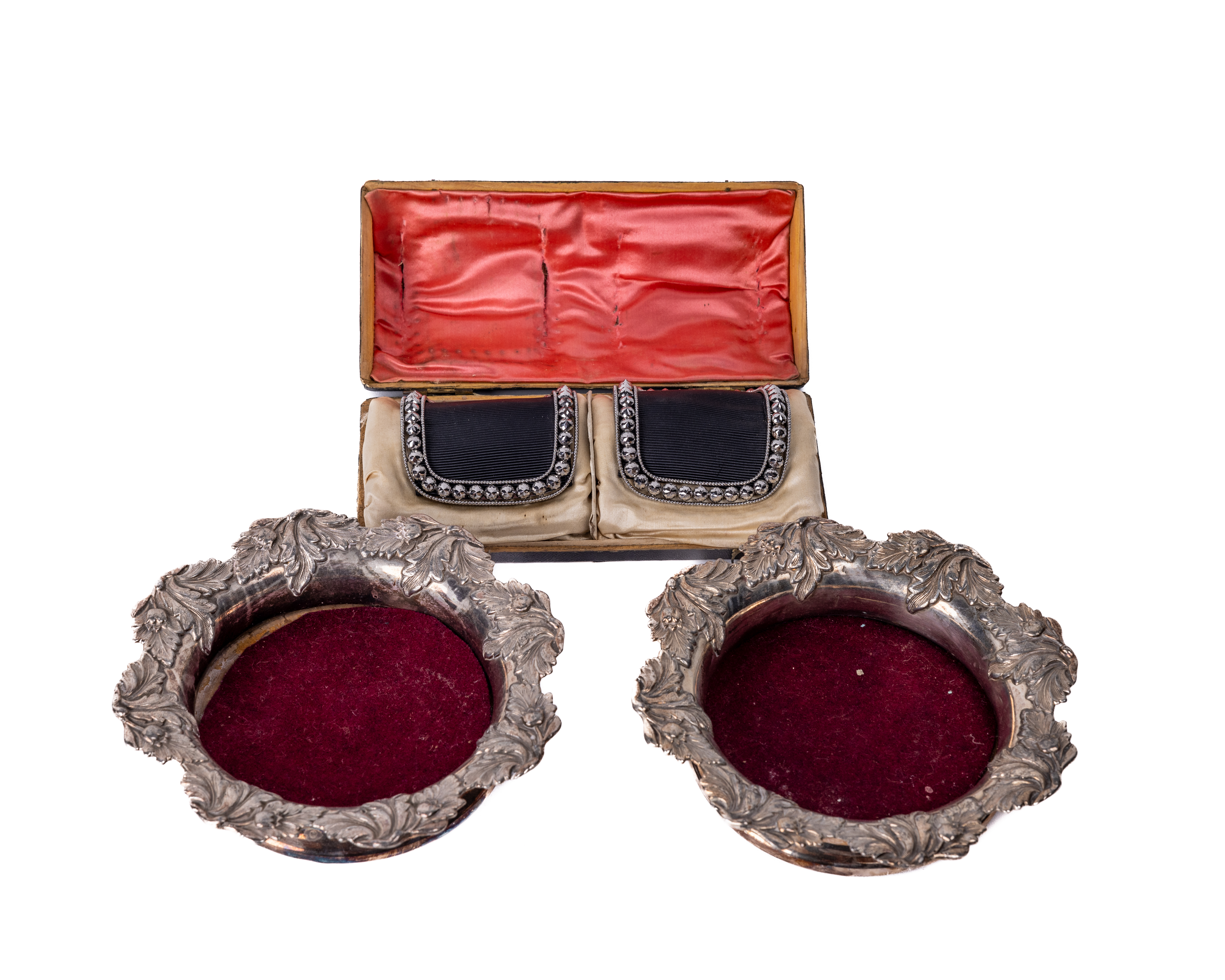 A pair of decorative silver plated Wine Coasters, the wooden centre with circular engraved plated