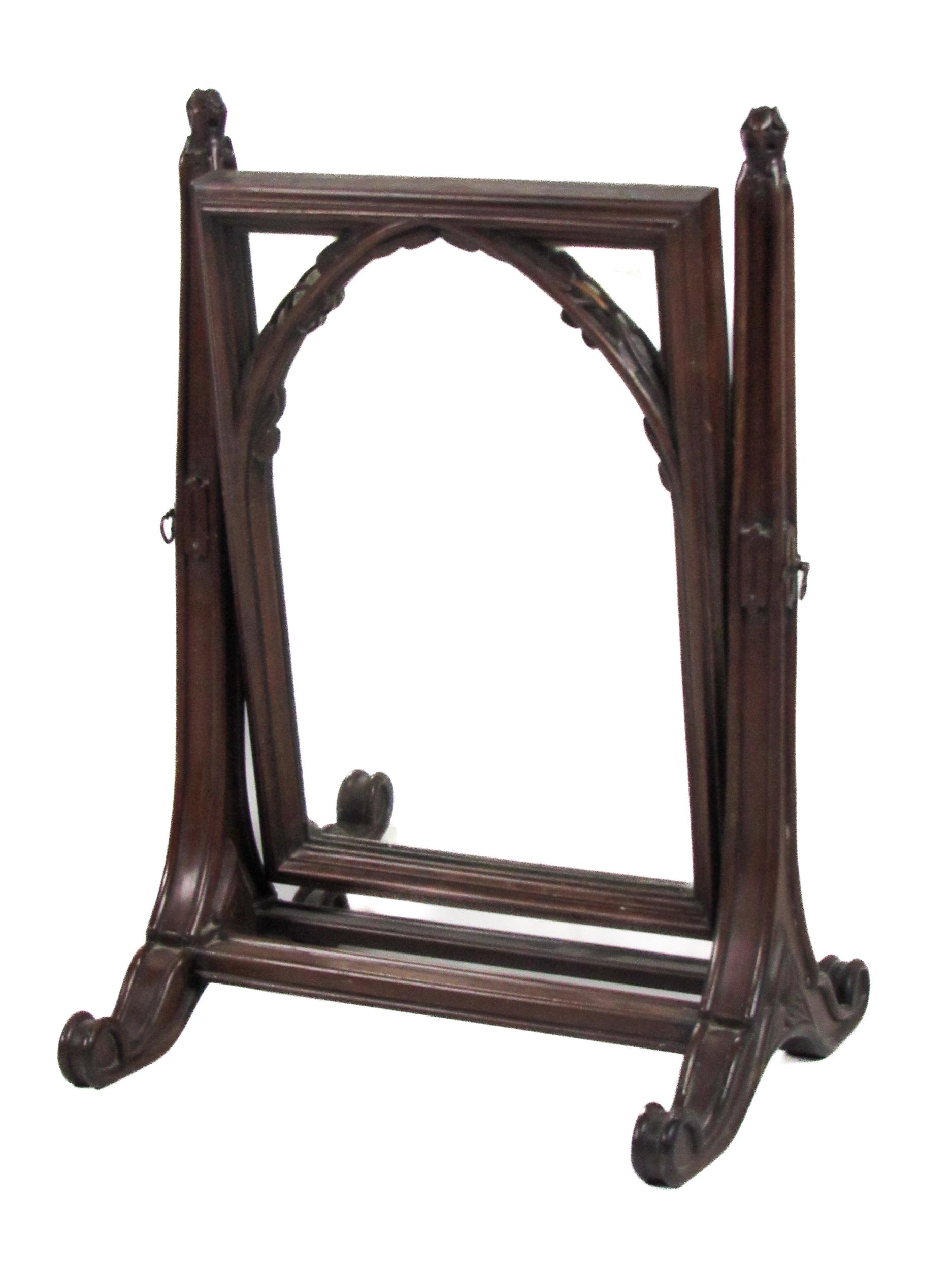 An unusual 19th Century mahogany framed Gothic style swing frame Dressing Table Mirror, with