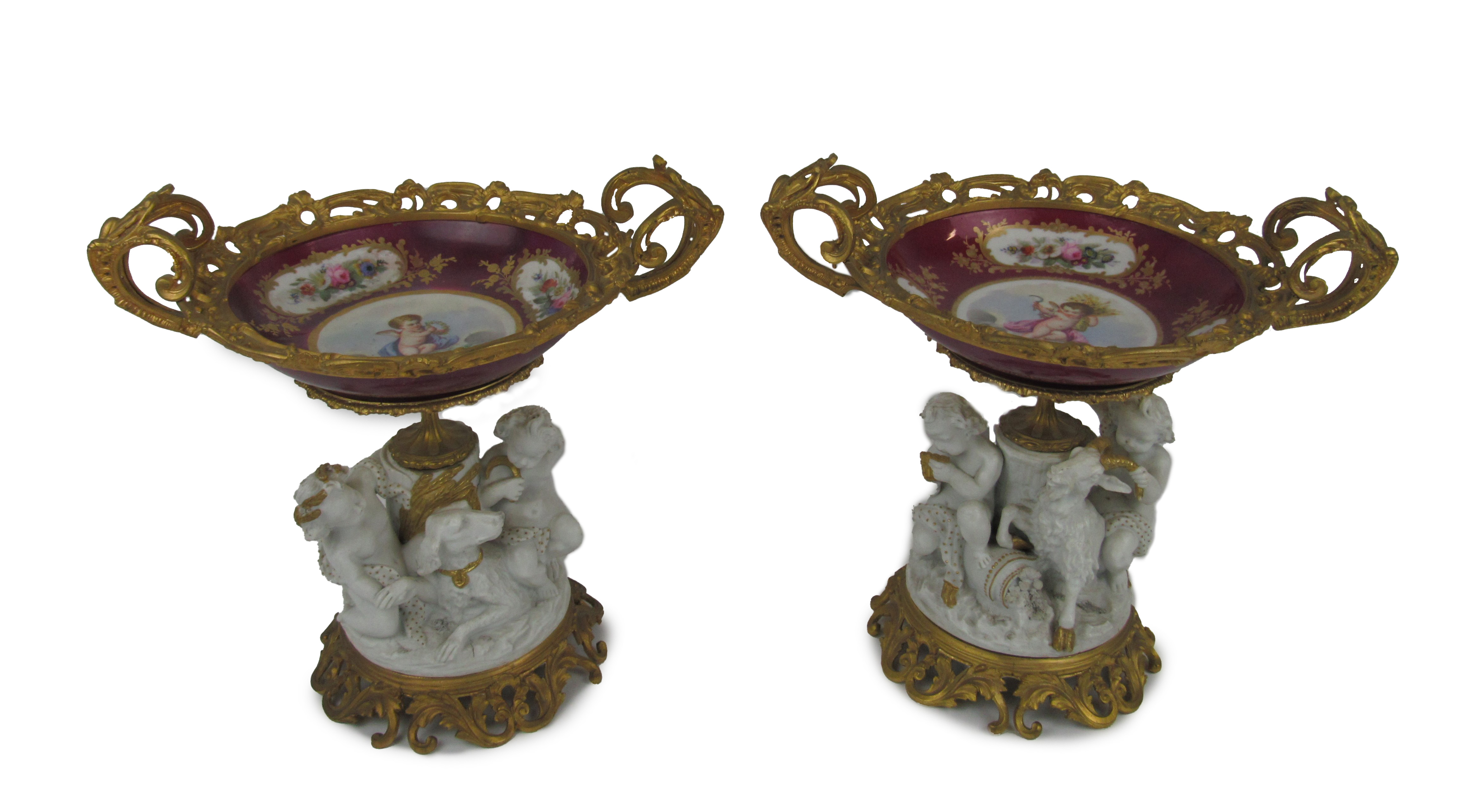 A pair of attractive ormolu mounted and hand painted porcelain Centerpiece's, decorated with flowers