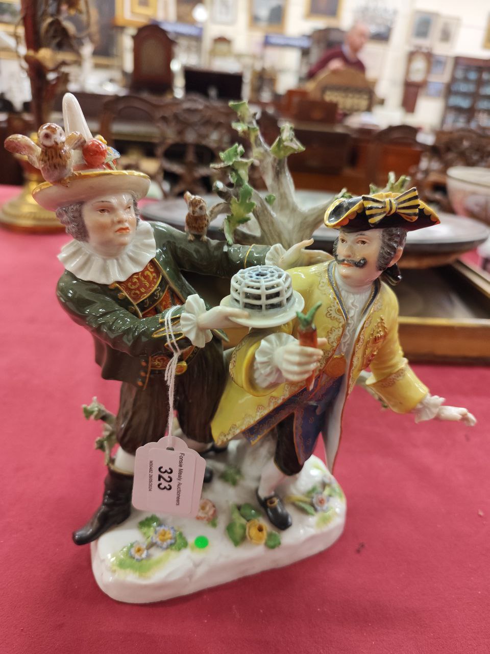 A large Meissen Group, with gentleman in bright yellow coat, and a Jester in green coat, offering - Image 4 of 5