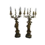 An attractive and fine quality pair of French ormolu and brass four branch cherub Candelabra,