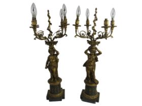 An attractive and fine quality pair of French ormolu and brass four branch cherub Candelabra,