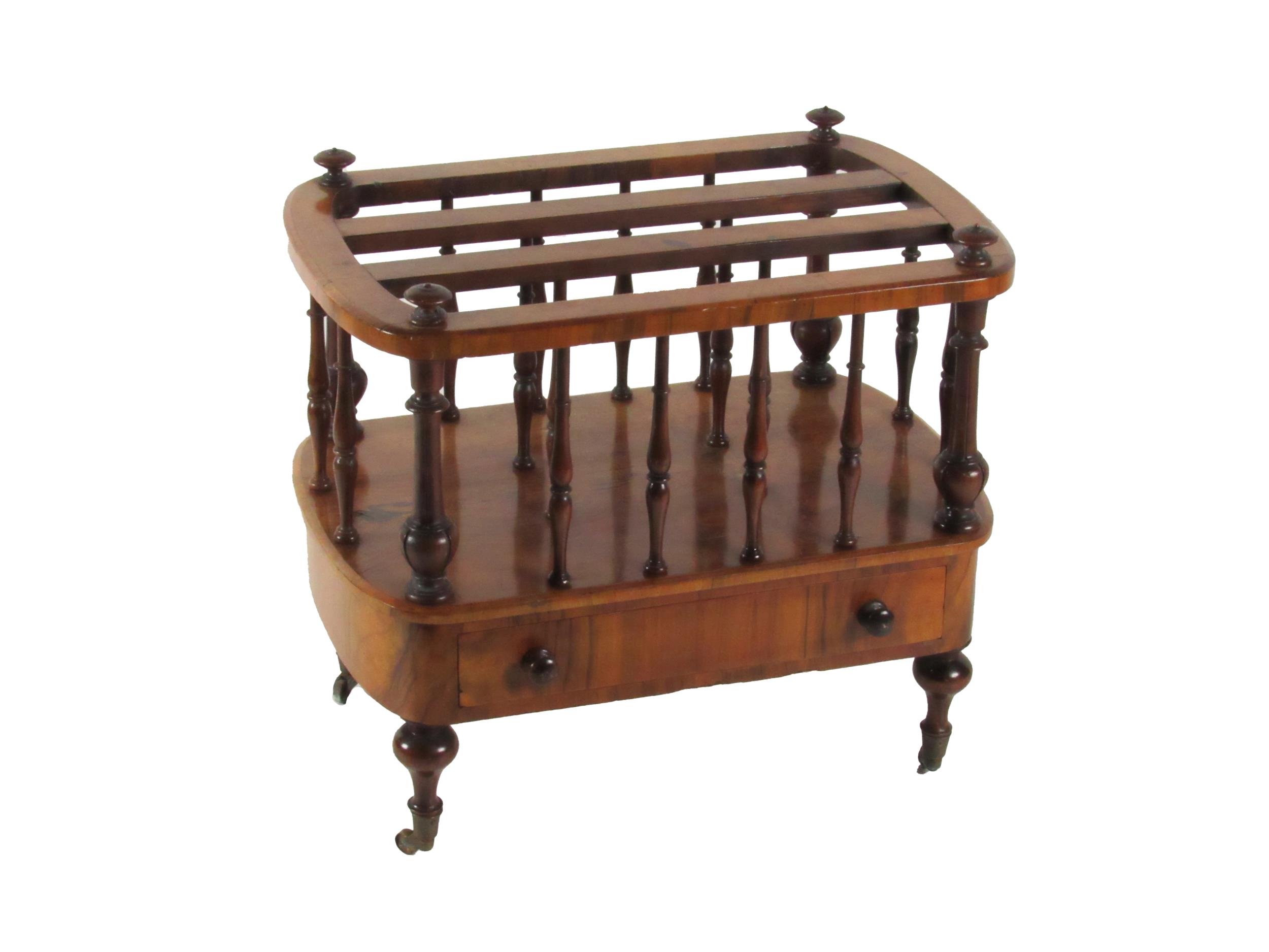 An Irish Victorian walnut Canterbury, in the manner of Strahan (Dublin), the top with demi-lune ends