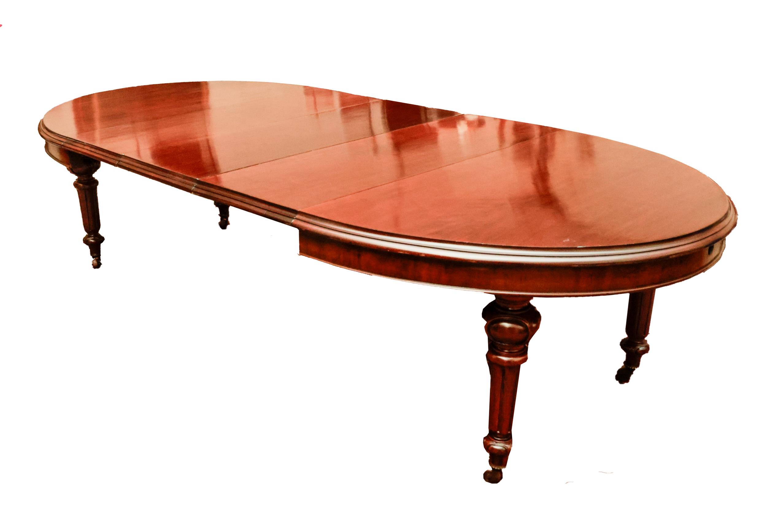 A fine quality Irish mahogany D end extendable Dining Table, attributed to Strahan of Dublin, with