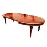 A fine quality Irish mahogany D end extendable Dining Table, attributed to Strahan of Dublin, with