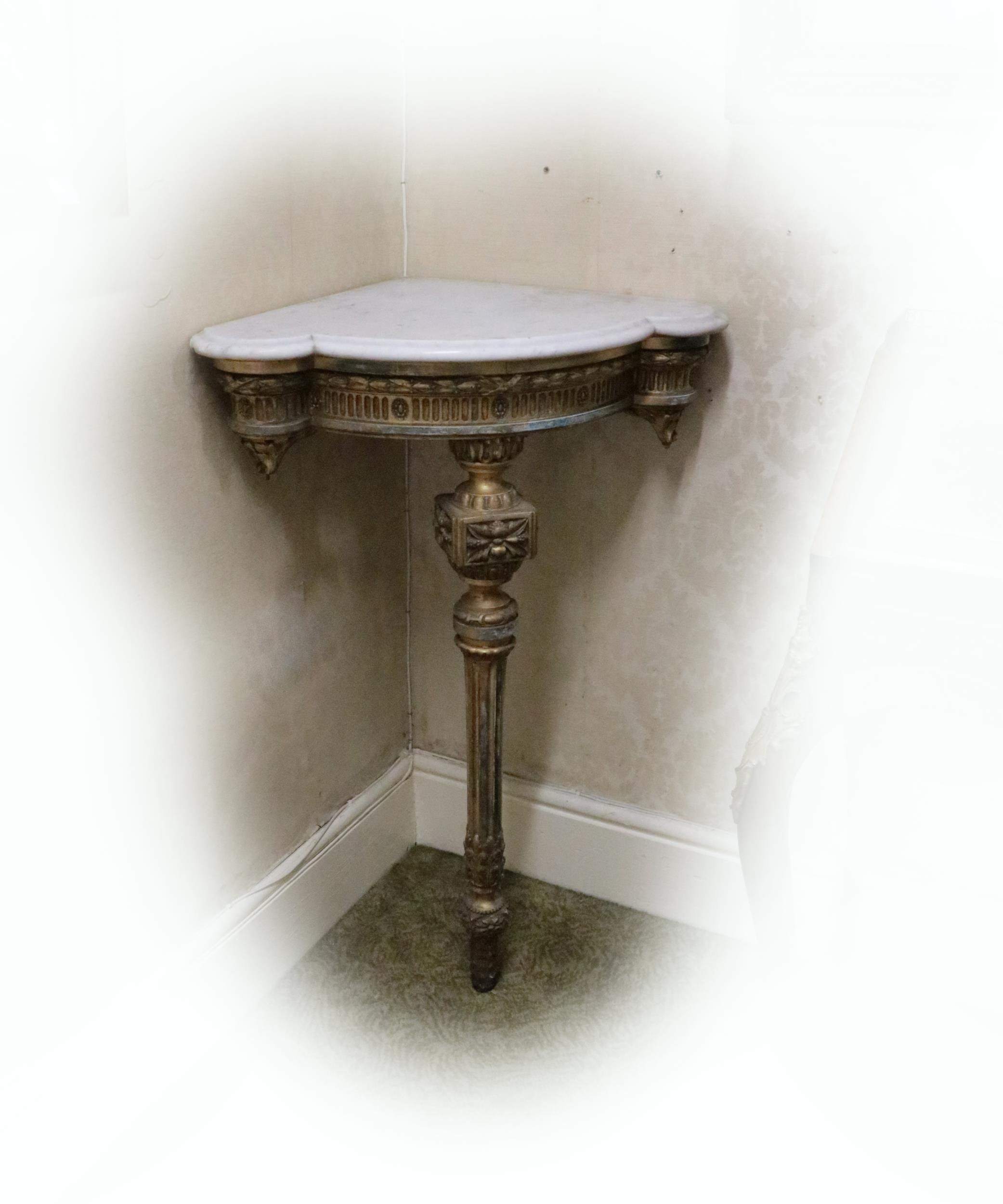 A pair of 19th Century English giltwood Corner Console Tables, each with moulded shaped white marble