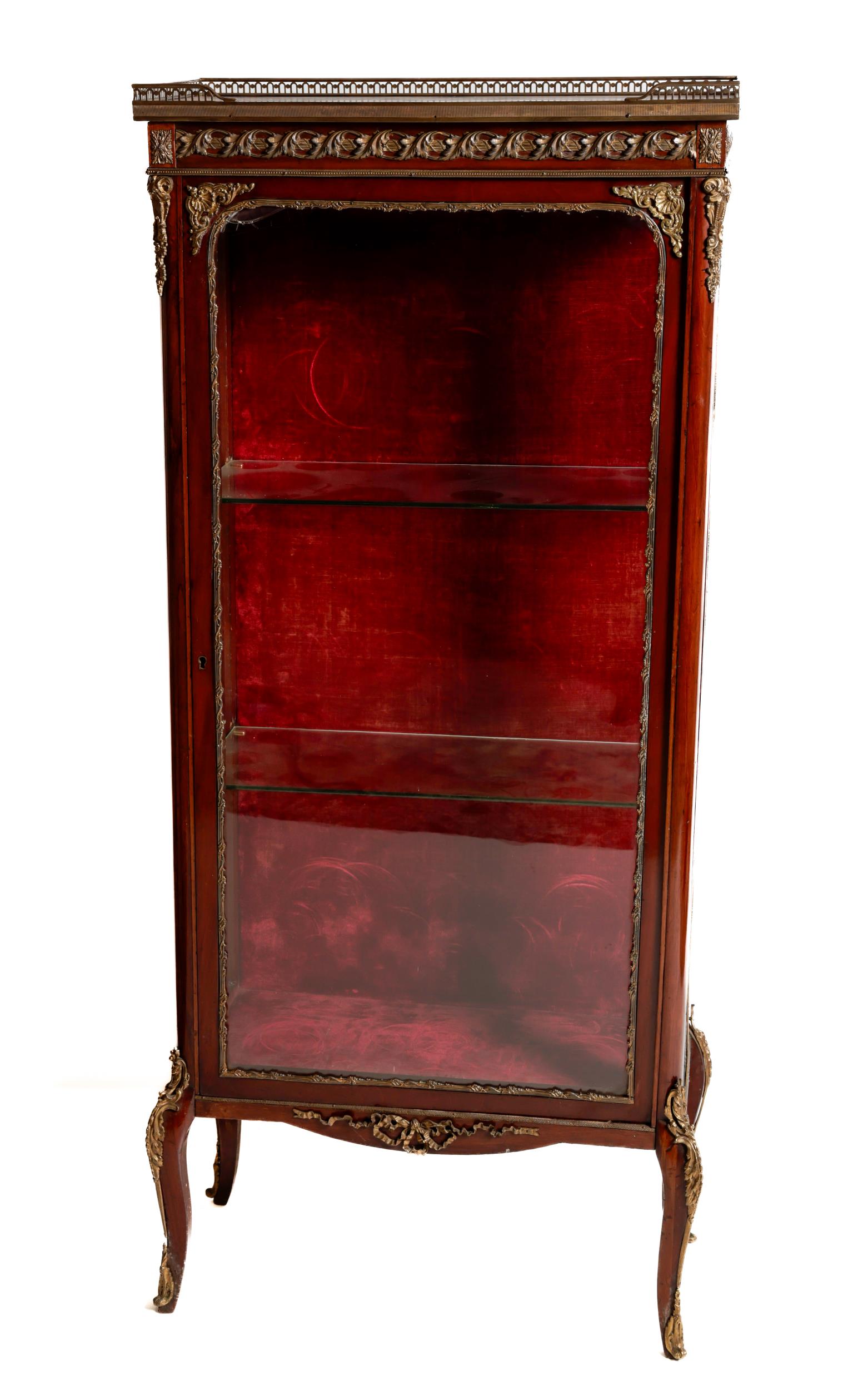 A fine quality Louis XVI style Vitrine, the marble inset top with pieced brass gallery over the