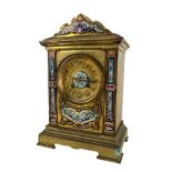 A 19th Century French brass Mantle Clock, with champlevé panels and cornice, the circular dial