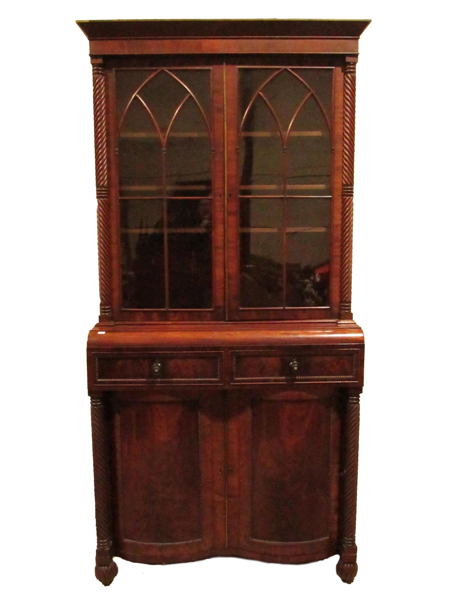 A good Nelson period mahogany Bookcase, with moulded cornice above two Gothic glazed doors flanked