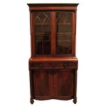 A good Nelson period mahogany Bookcase, with moulded cornice above two Gothic glazed doors flanked