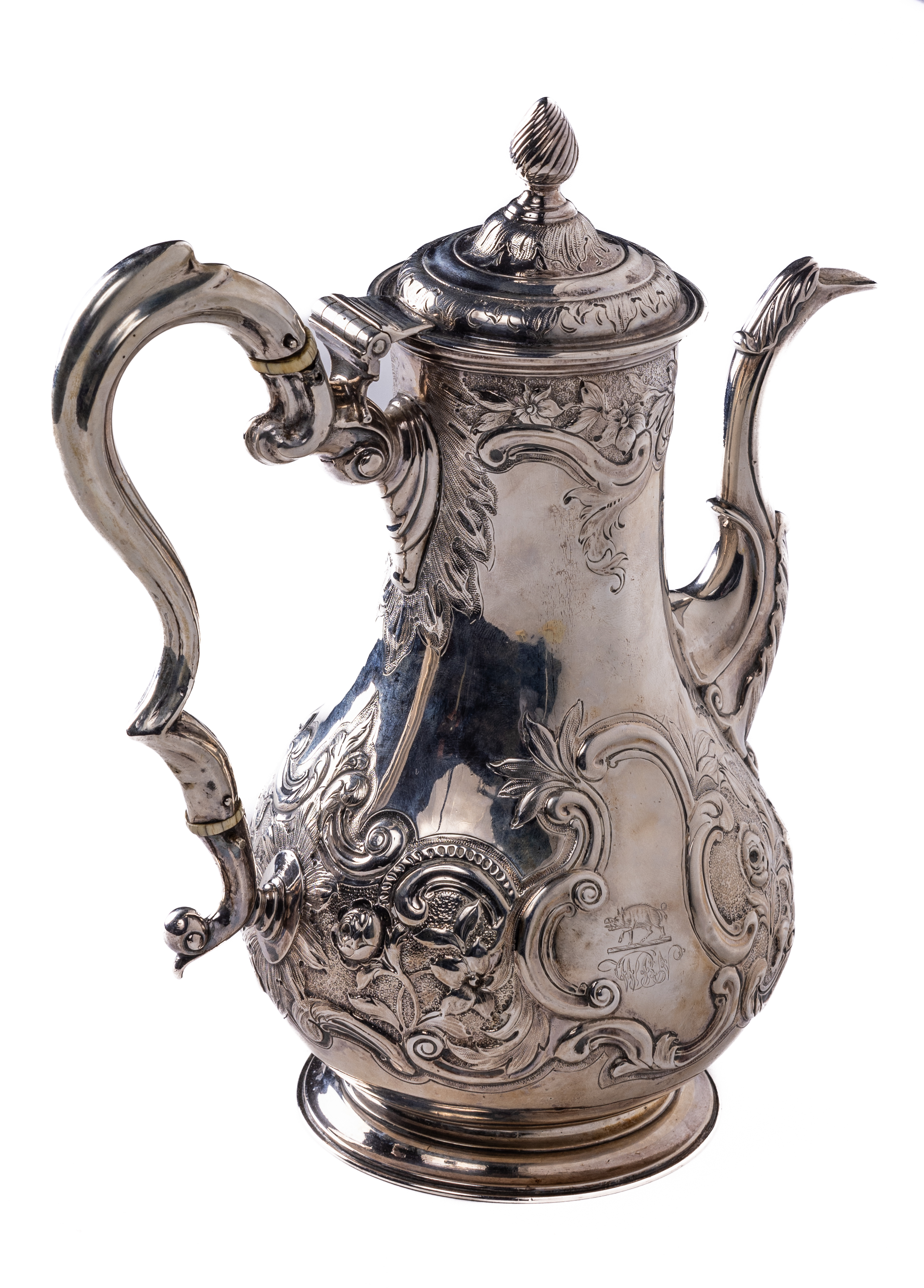 An important 18th Century Irish Provincial Coffee Pot, of attractive embossed floral decoration in