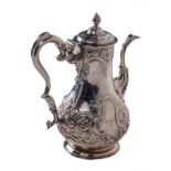 An important 18th Century Irish Provincial Coffee Pot, of attractive embossed floral decoration in