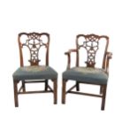 A set of 6 (4 + 2) mahogany Dining Chairs, decorated in the Chippendale style, with ornate carved