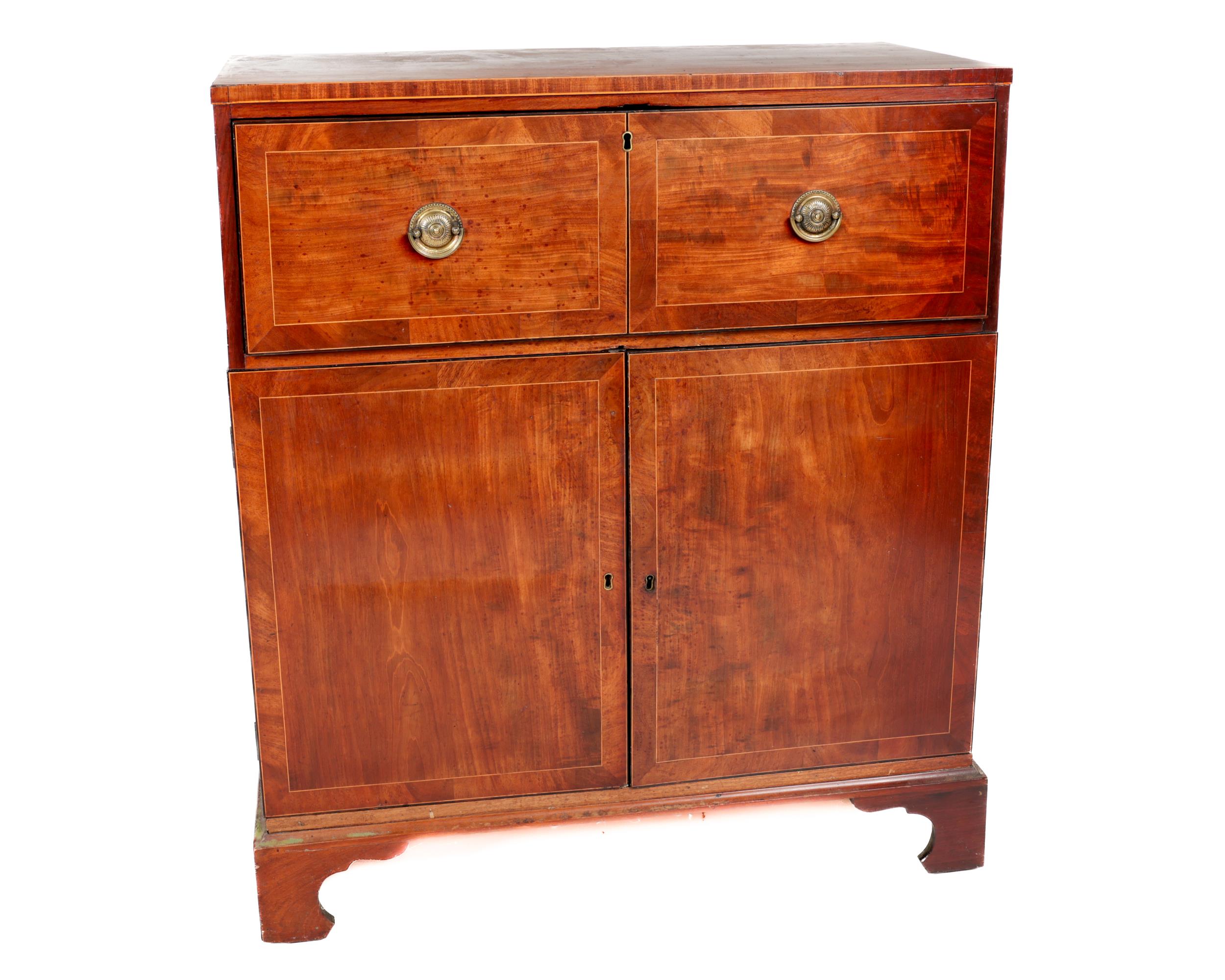 A Georgian mahogany pull-out Bureau, the plain top over first drawer opening to reveal fitted