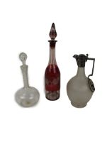 An attractive silver plated frosted glass Claret Jug, a tall etched crimson glass Decanter and