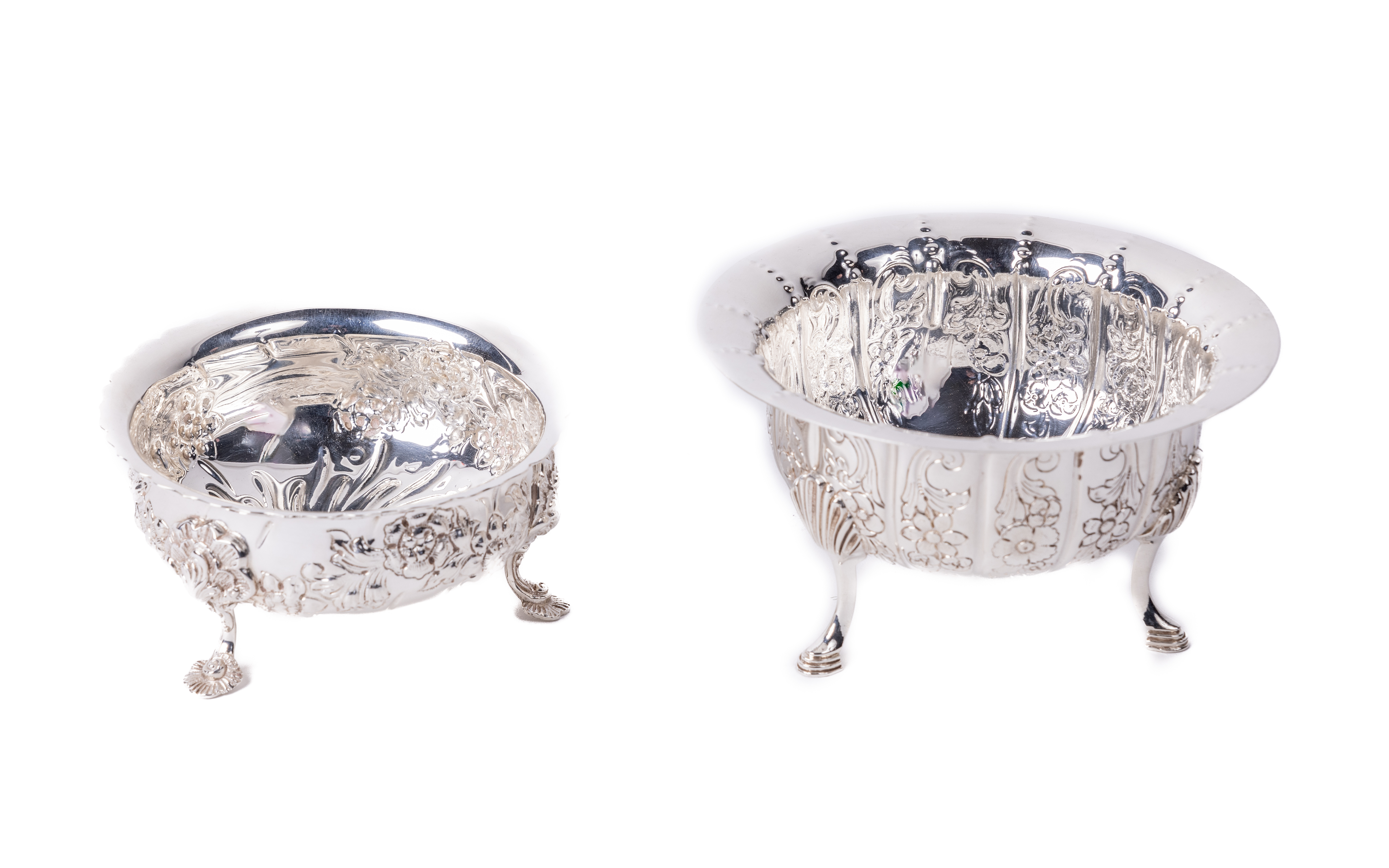 A Georgian style silver repousse decorated Sugar Bowl, by Royal Irish, with floral design, on