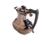 An English Georgian style Sheffield silver Coffee Pot, of bulbous form with ebonised handle and