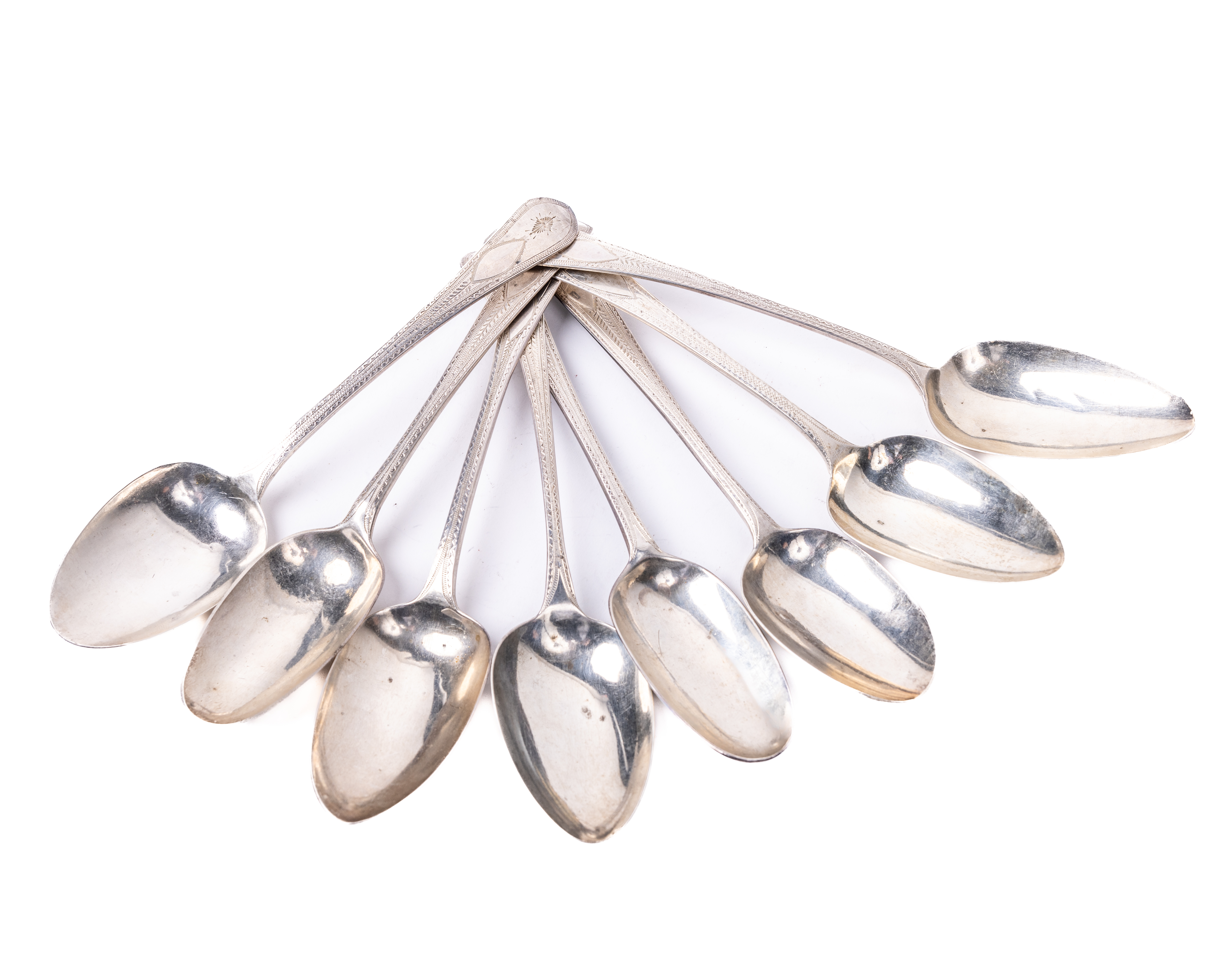 A set of 8 varied Irish and English silver Spoons, with matching bright cut design, makers mark of